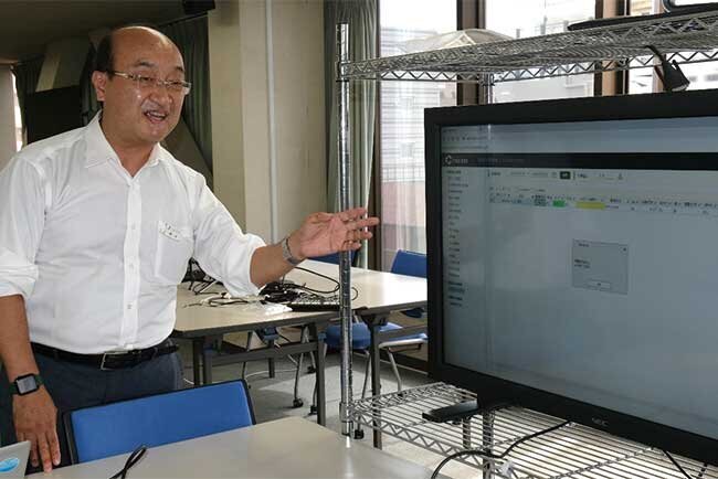 RPAの効果を説明する村上慎悟上席執行役員