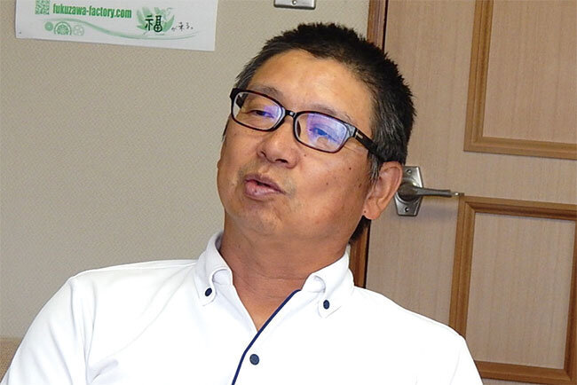 創業の経緯などを語る小松正芳代表取締役社長