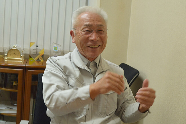 社の沿革を話す木村一利代表取締役