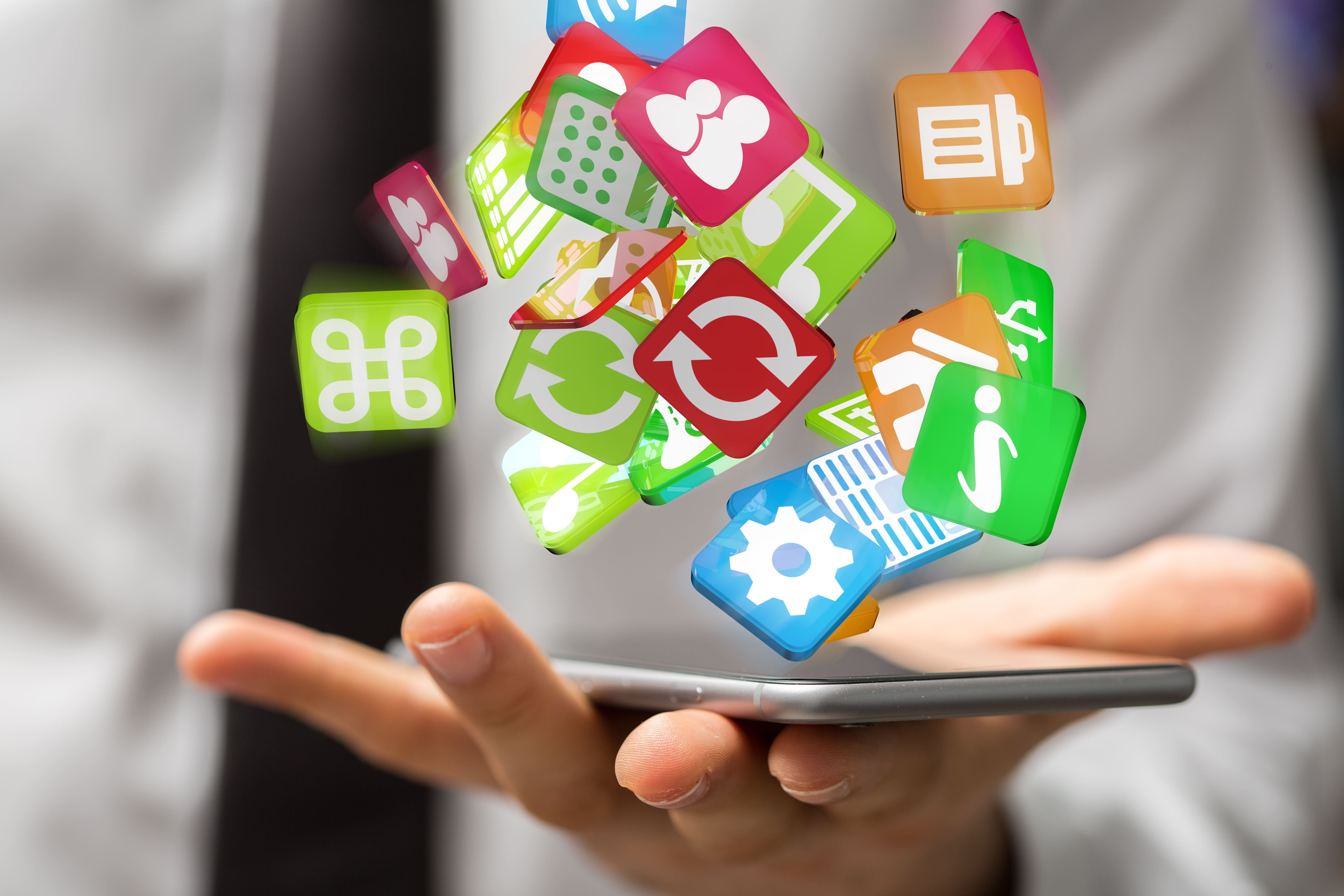 スマートフォンからアプリのアイコンが飛び出すイメージ画像。アプリマーケティングやモバイル端末を活用した施策を表している。