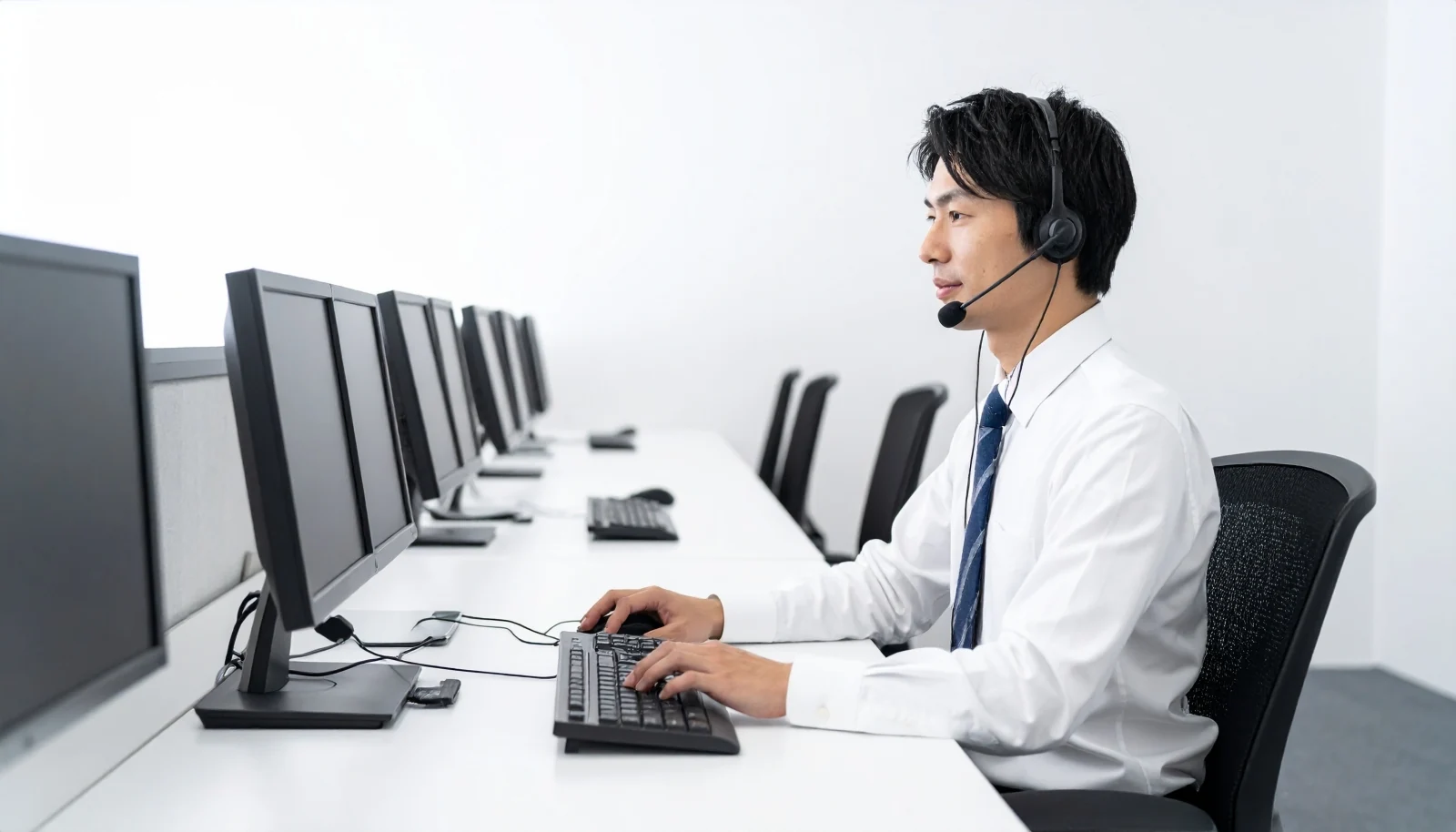Call center agent handling customer inquiries at a desk